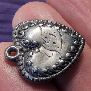 Antique sterling silver puffed heart charm